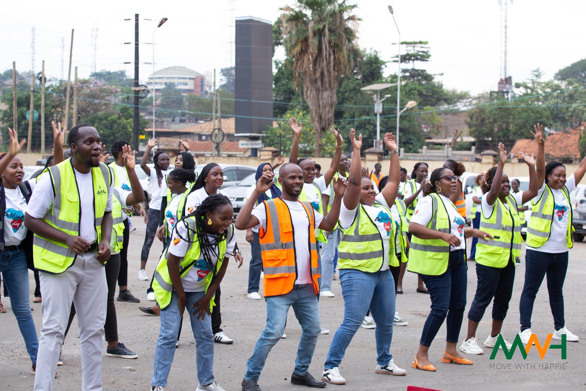 Company staff in high-visibility vests moving together at an MWH session